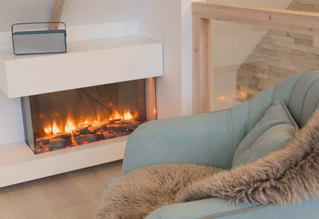 A contemporary fire keeps you warm and cosy.