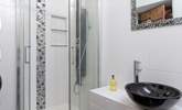 The en suite shower-room for Bedroom 5 has fun decor.  - Thumbnail Image