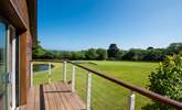 The balcony from the master bedroom overlooks the grounds.  - Thumbnail Image