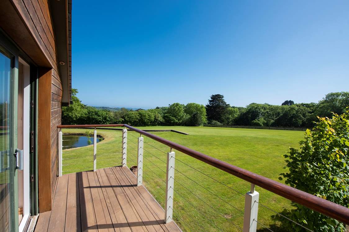 The balcony from the main bedroom overlooks the grounds.