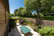 Enjoy a game of table tennis in the courtyard behind the kitchen.
