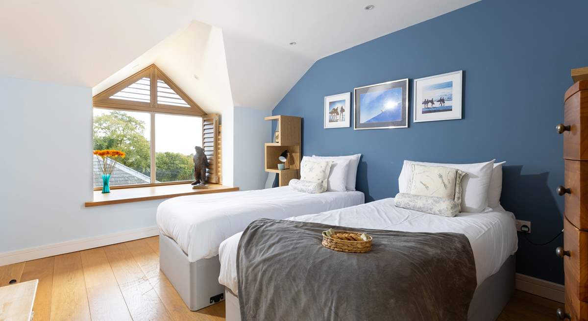 The blue bedroom can be set up as twins or a super king bed and has far reaching views to the sea on a clear day. 