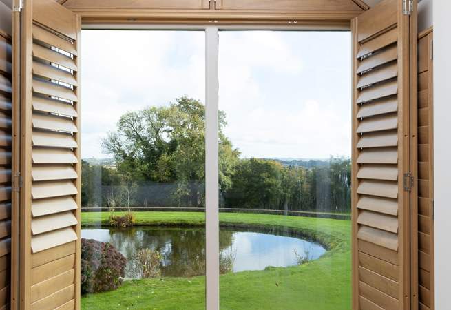 This bedroom looks over the grounds and on a clear day out to sea. 