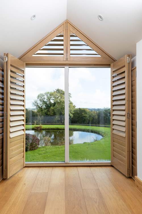 This bedroom looks over the grounds and on a clear day out to sea.