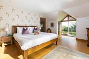 This fabulous bedroom has a dressing-room and a huge en suite bathroom.