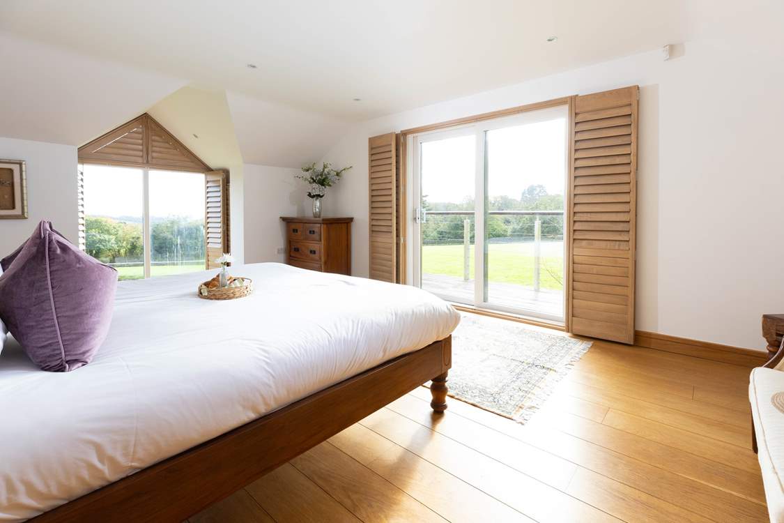Enjoy opening the doors to your private balcony and feel the fresh breeze and far reaching views to the sea in the distance.