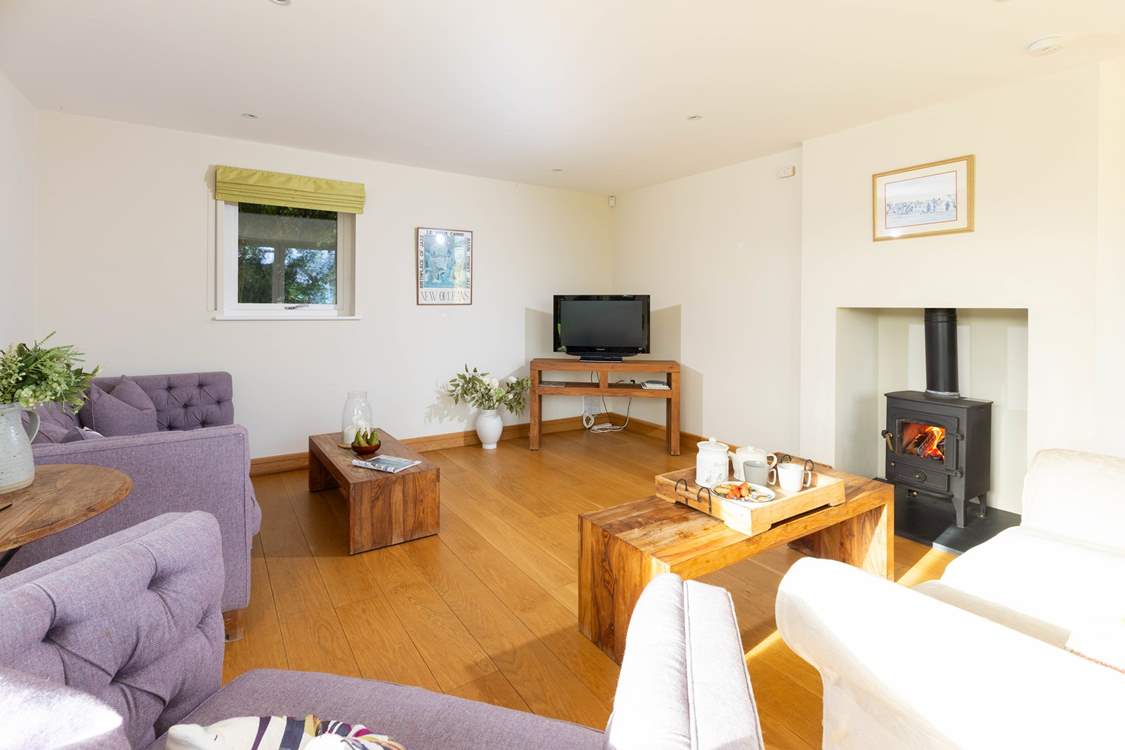 Cosy up in front of the wood-burner in the snug.