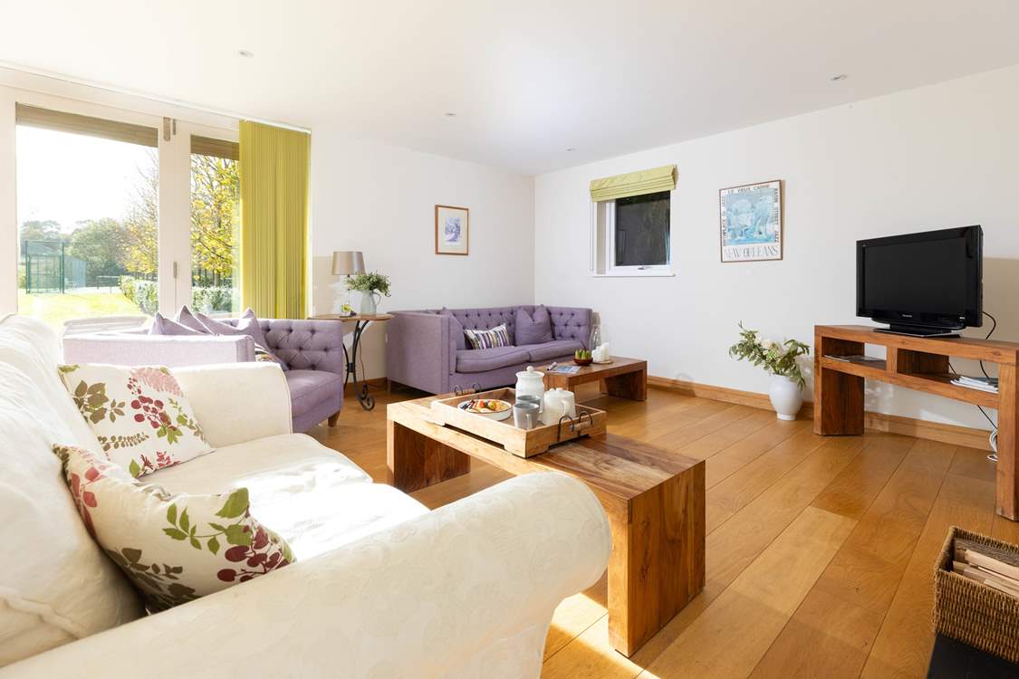 The snug is at the far end of the kitchen/diner and is a lovely space to relax after supper.