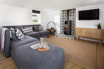 Spacious living area with lovely homely touches.