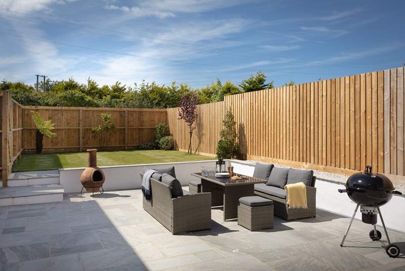 You have a barbecue too, perfect for those balmy summer evenings. Two steps lead up to the garden area. 