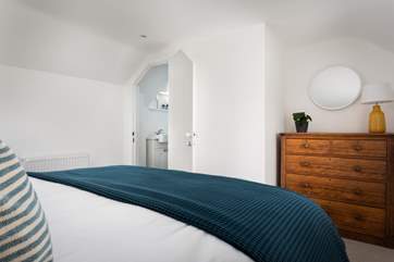 The en suite shower-room is tucked under the eaves.