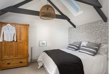 Three steps lead up into bedroom number three. Look at the fabulous lobster pot light! 