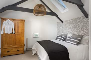 Three steps lead up into bedroom number three. Look at the fabulous lobster pot light!