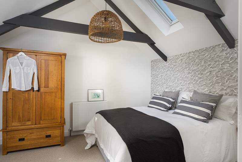 Three steps lead up into bedroom number three. Look at the fabulous lobster pot light! 