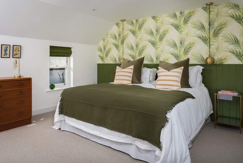 Bedroom number 1, is beautiful in green palms and creams.