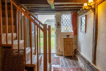 Rustic with exposed walls and leaded windows.