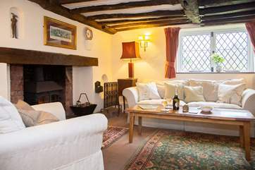 The sitting-room has plenty of room for family and friends.