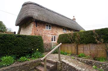 Steps and a path that lead to the front door and garden of Danny Cottage.