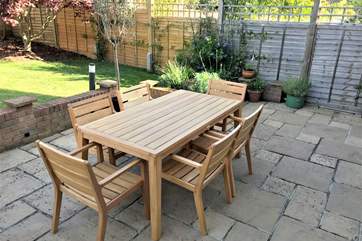 Dine al fresco while watching the children play on the lawn.