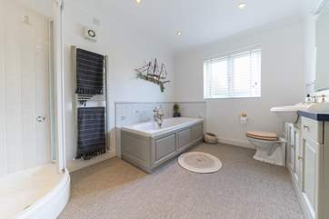 The large family bathroom with separate shower cubicle.