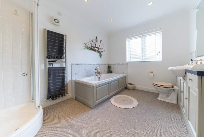 The large family bathroom with separate shower cubicle. 