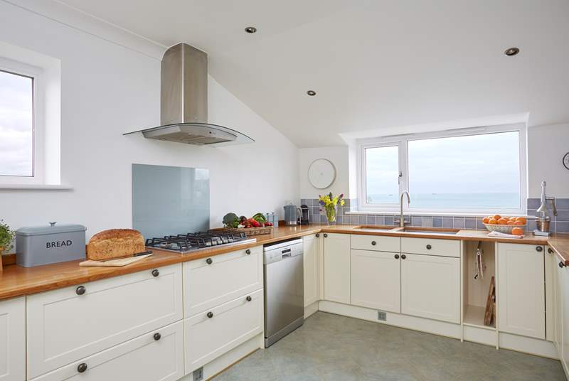 Enjoy cooking in this well-equipped spacious kitchen with sea views.