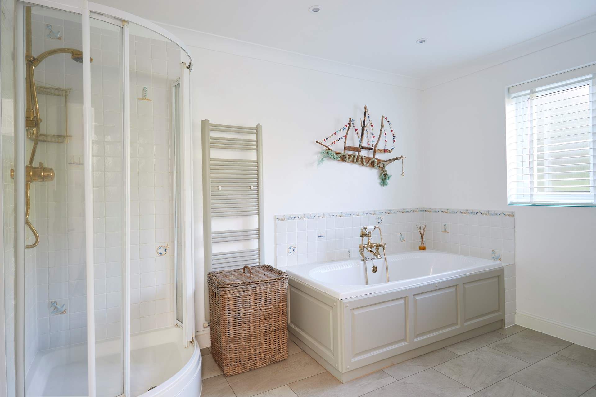 The large family bathroom with separate shower cubicle. 