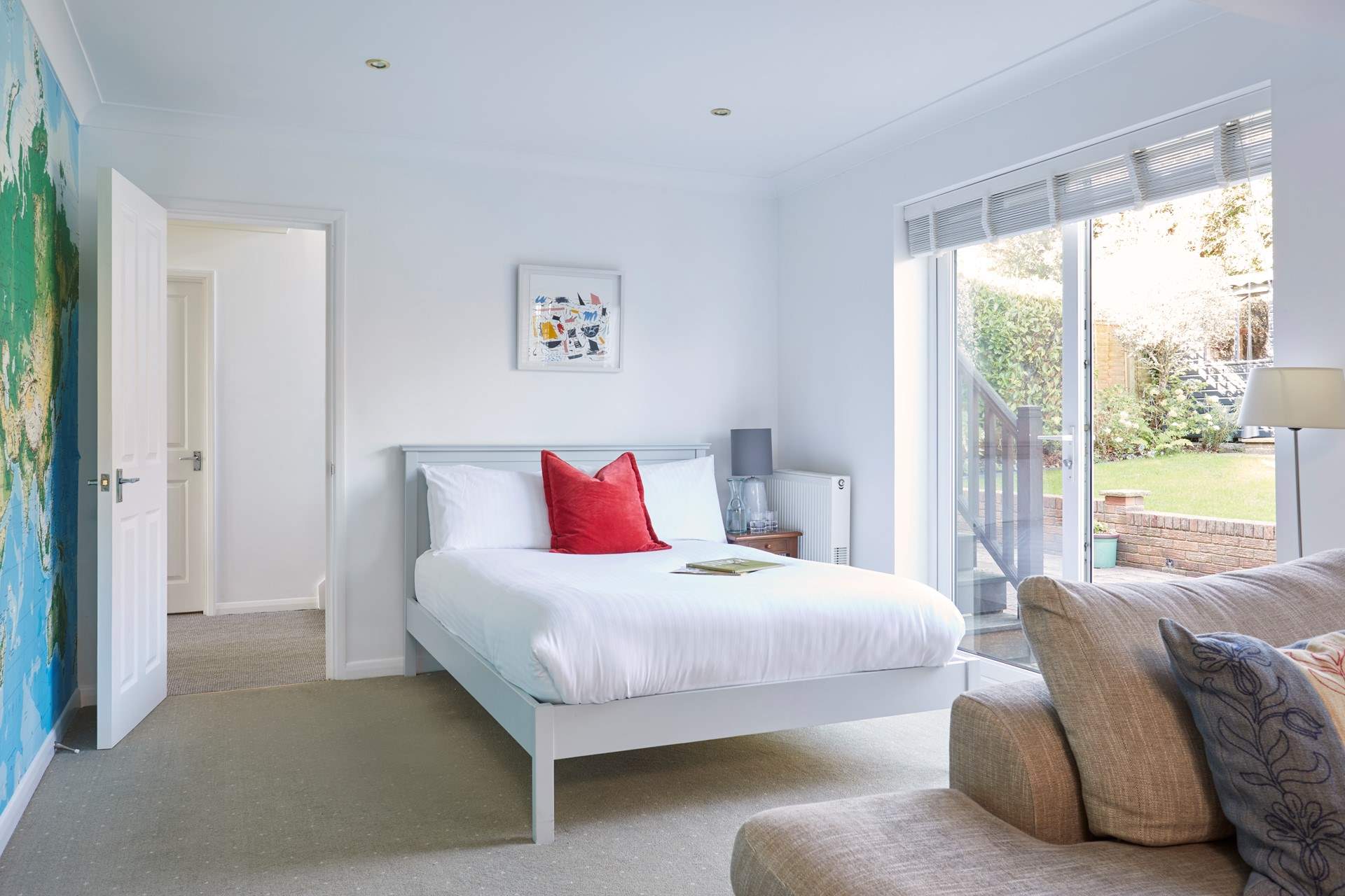 Bedroom 2 is located on the ground floor with double bed and patio doors leading to the lovely garden.