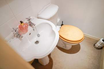 The WC located opposite bedroom 2 and is one step up from the entrance hall.