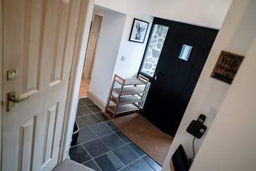 The entrance hall leads to the main reception rooms by stepping down one step, and in the other direction you step up one step to Bedrooms 1 and 2. This is where the WC is also located.