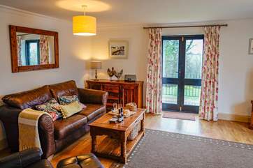 On those long summer nights the patio doors can be open to enjoy not only the breeze but the views across the treetops.