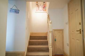 As you step down from the entrance hall these stairs lead you up to the twin bedroom.