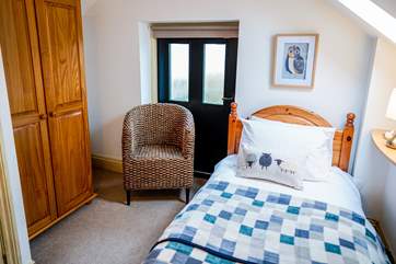 The twin room has two three-foot beds. The door is just a feature and is not used, a blind will be pulled down over the door.