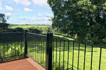 Town Barn has far reaching views from a private garden and the wrap-around decking.