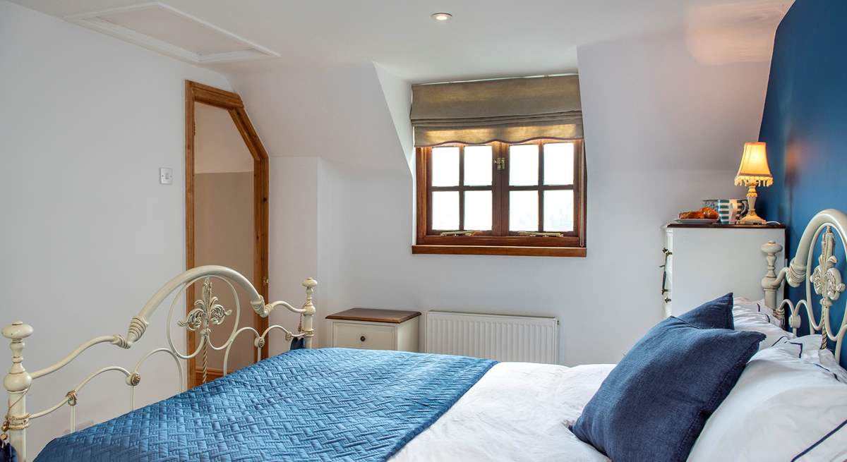 This bedroom also overlooks both the garden and the front of the cottage. 