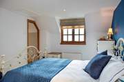 This bedroom also overlooks both the garden and the front of the cottage. 