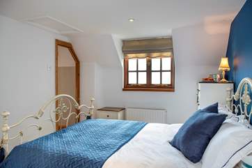 This bedroom also overlooks both the garden and the front of the cottage.