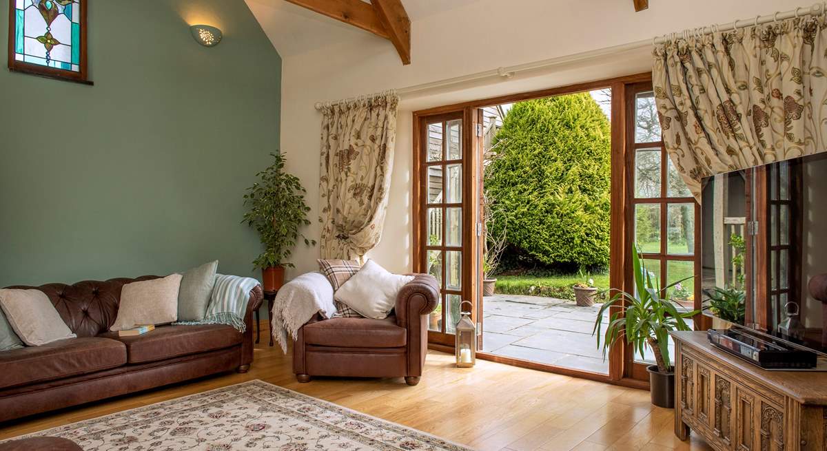 The sitting-room opens to the patio and is light and airy. 