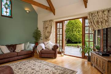 The sitting-room opens to the patio and is light and airy.