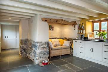 The kitchen leads to the utility space and family shower-room.