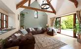 The sitting-room opens to the patio and is beautifully appointed. - Thumbnail Image