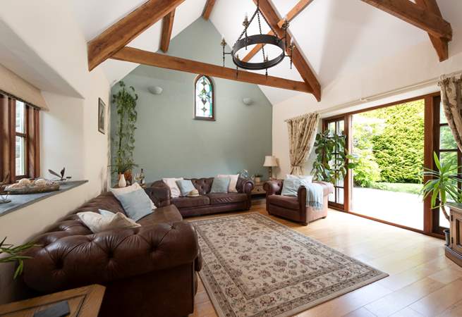 The sitting-room opens to the patio and is beautifully appointed.