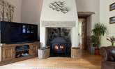 Cosy up next to the wood-burner on cooler evenings. - Thumbnail Image