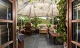 The conservatory is a sophisticated space, with botanical grace. - Thumbnail Image