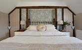 Bedroom 1 has a fabulous king-size bed and en suite cloakroom. - Thumbnail Image