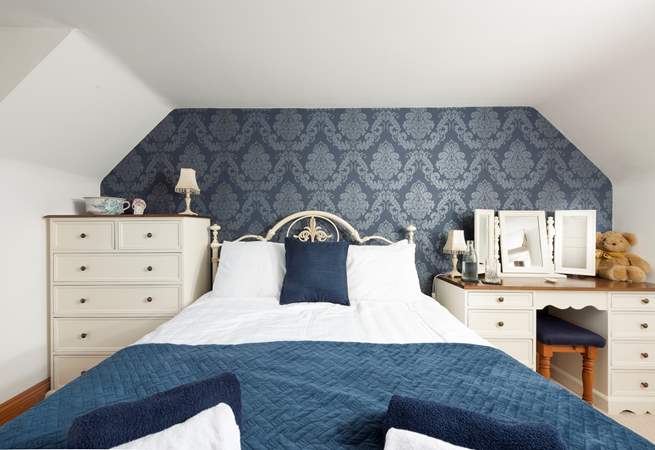 Another king-size room invites restful slumber.