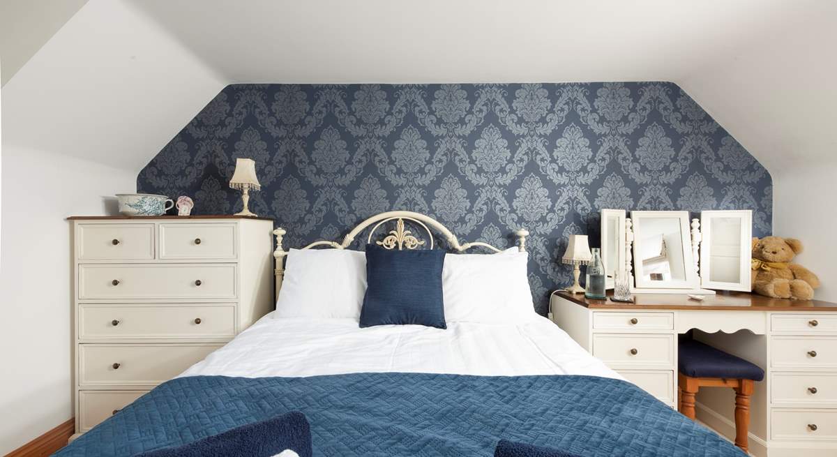 Another king-size room invites restful slumber.