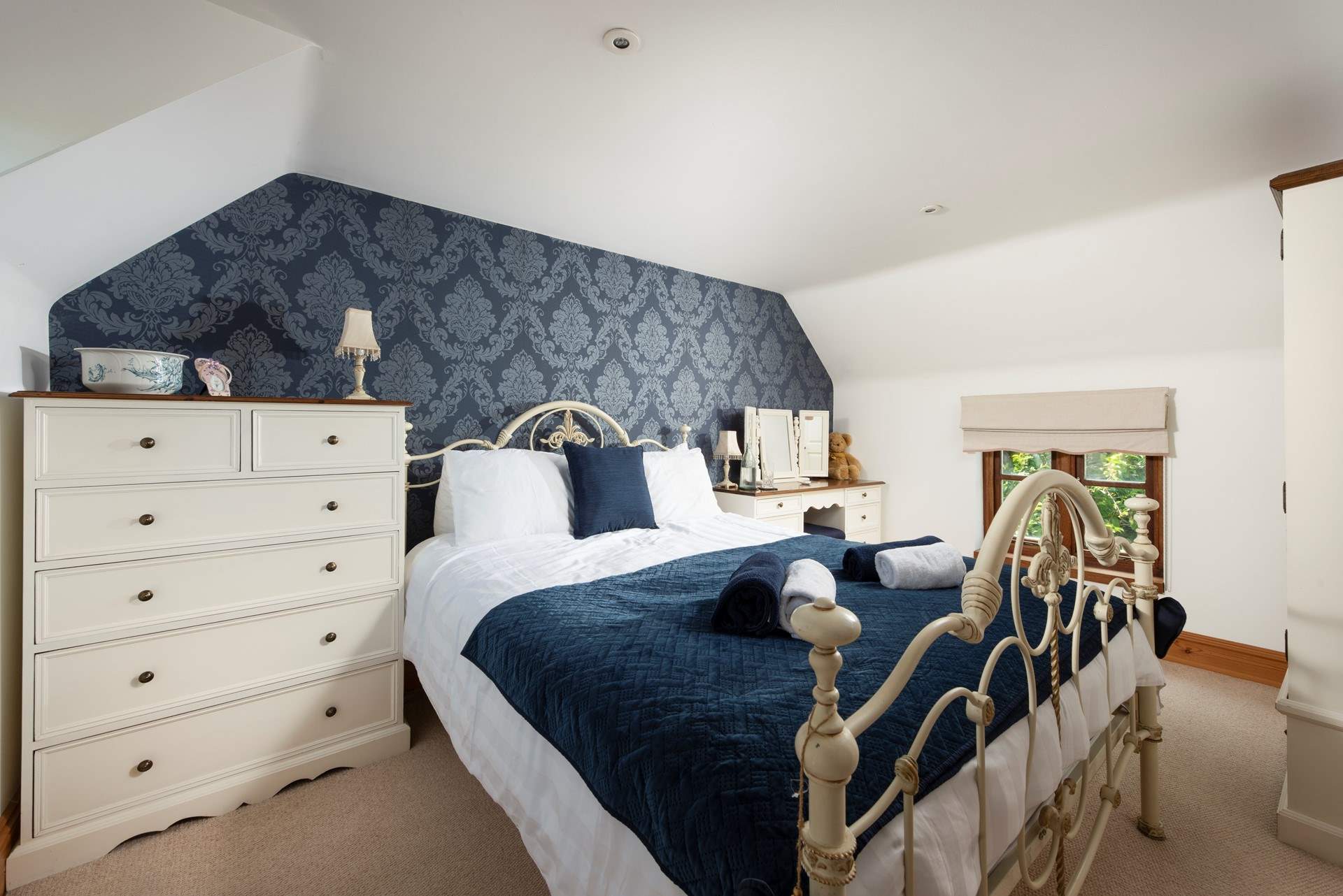 Sapphire shades in this opulent bedroom.