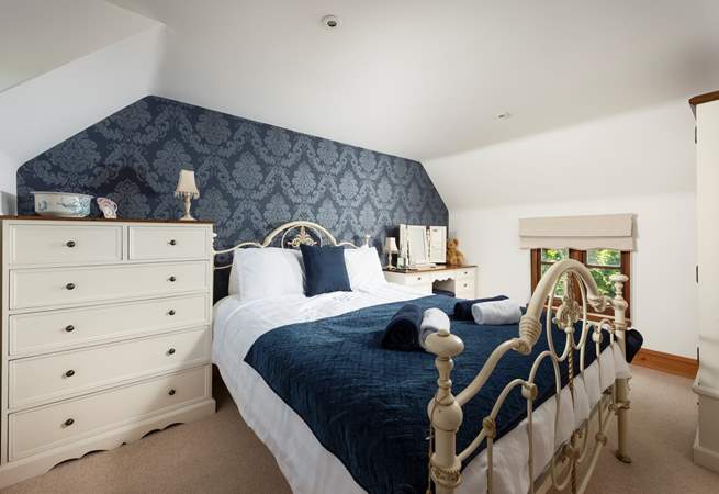 Sapphire shades in this opulent bedroom.