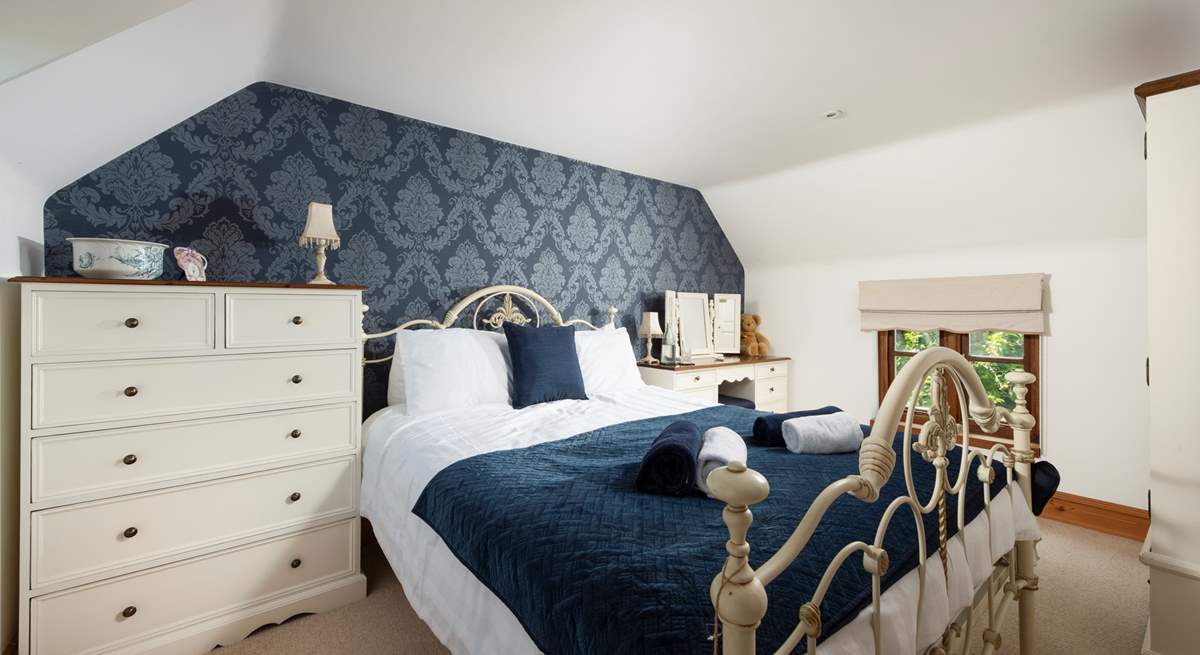 Sapphire shades in this opulent bedroom.